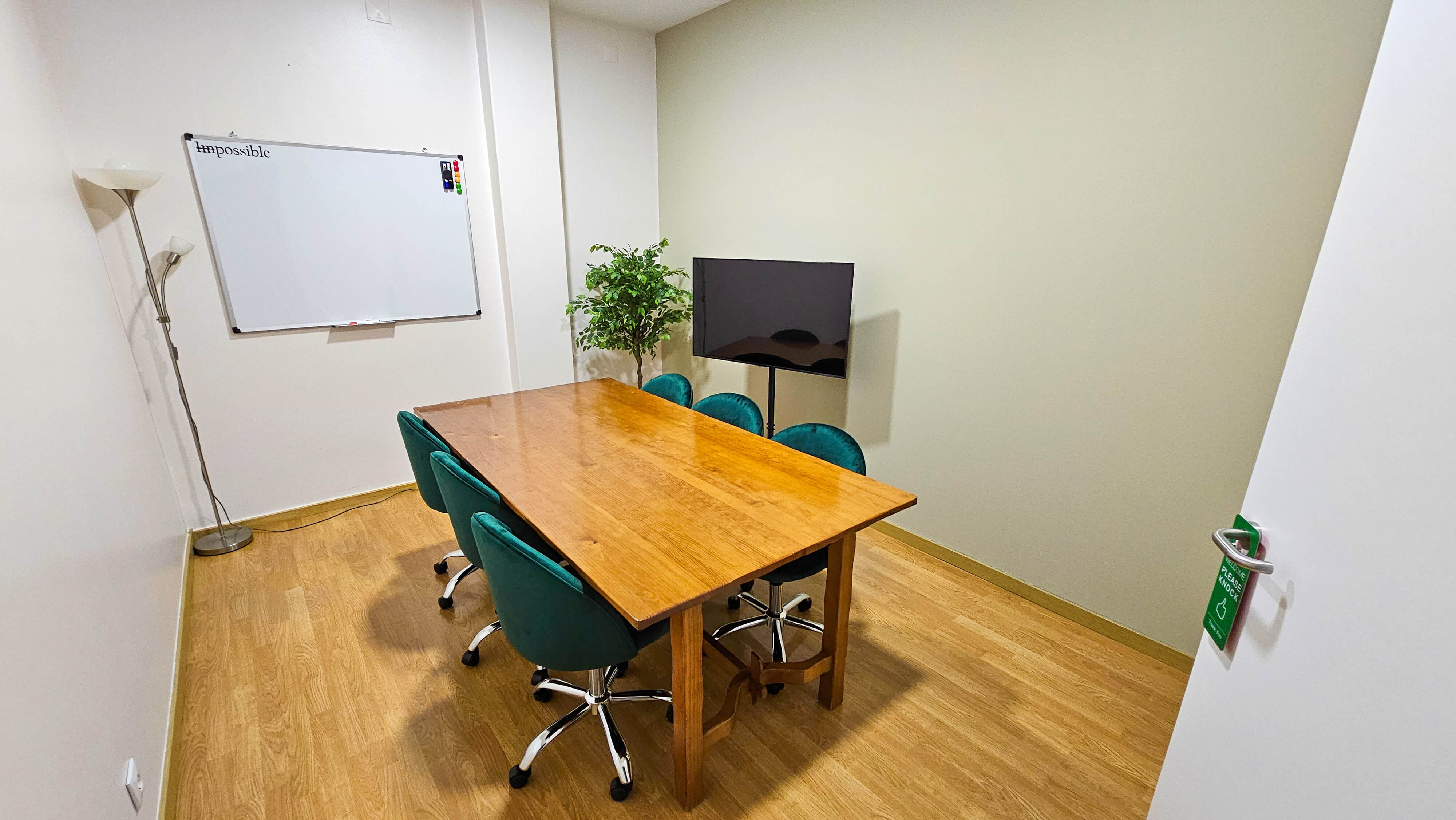 Meeting room with conference table and whiteboard