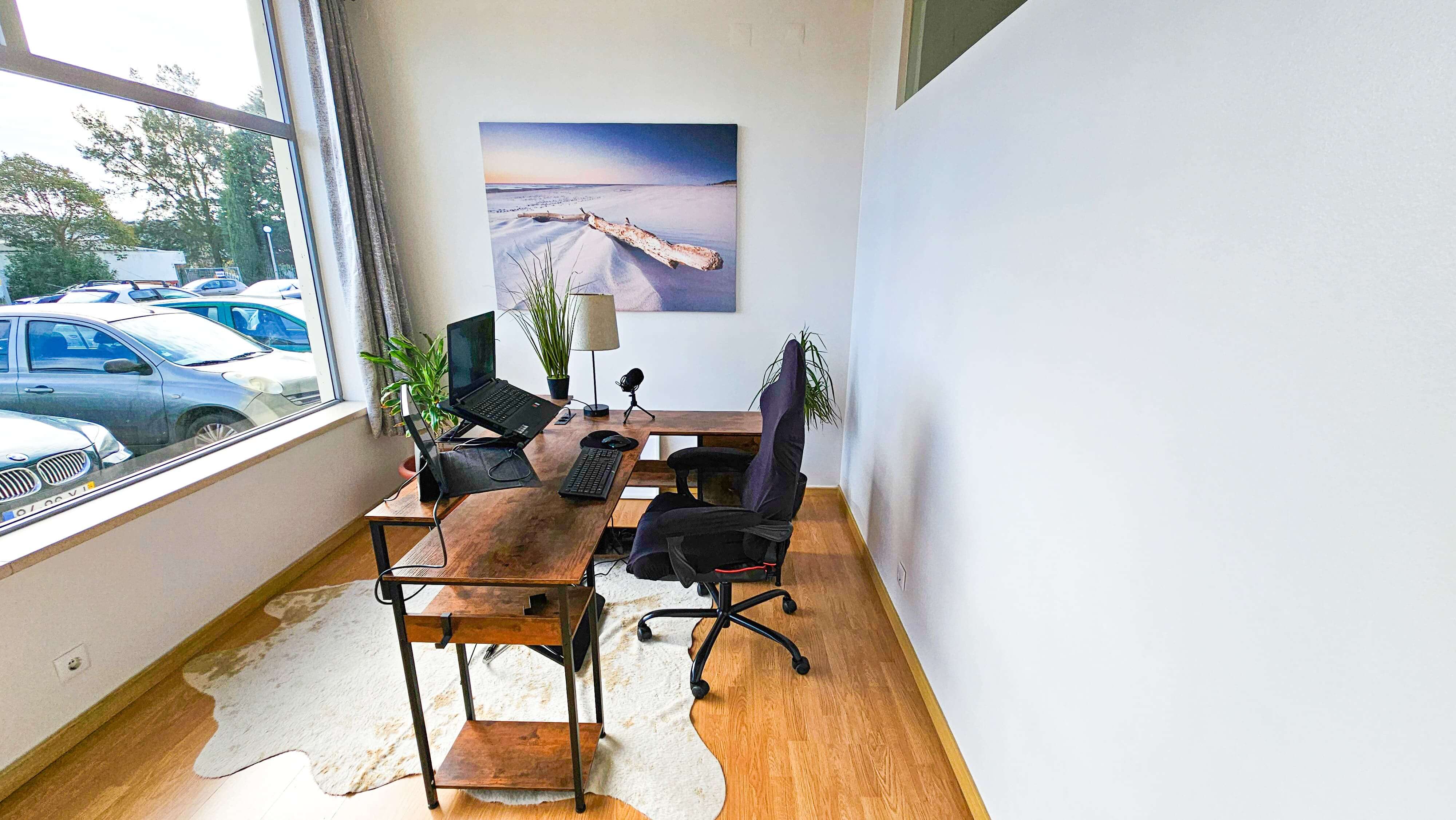 Private office space with coastal artwork